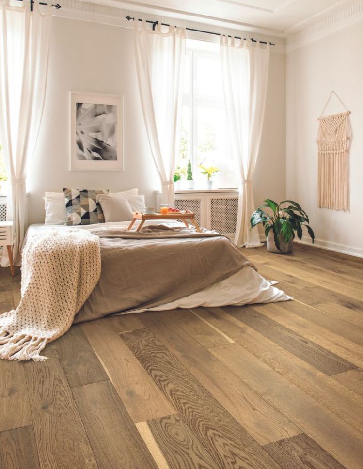 bright hardwood floors in a Sherman Oaks bedroom with neutral tones